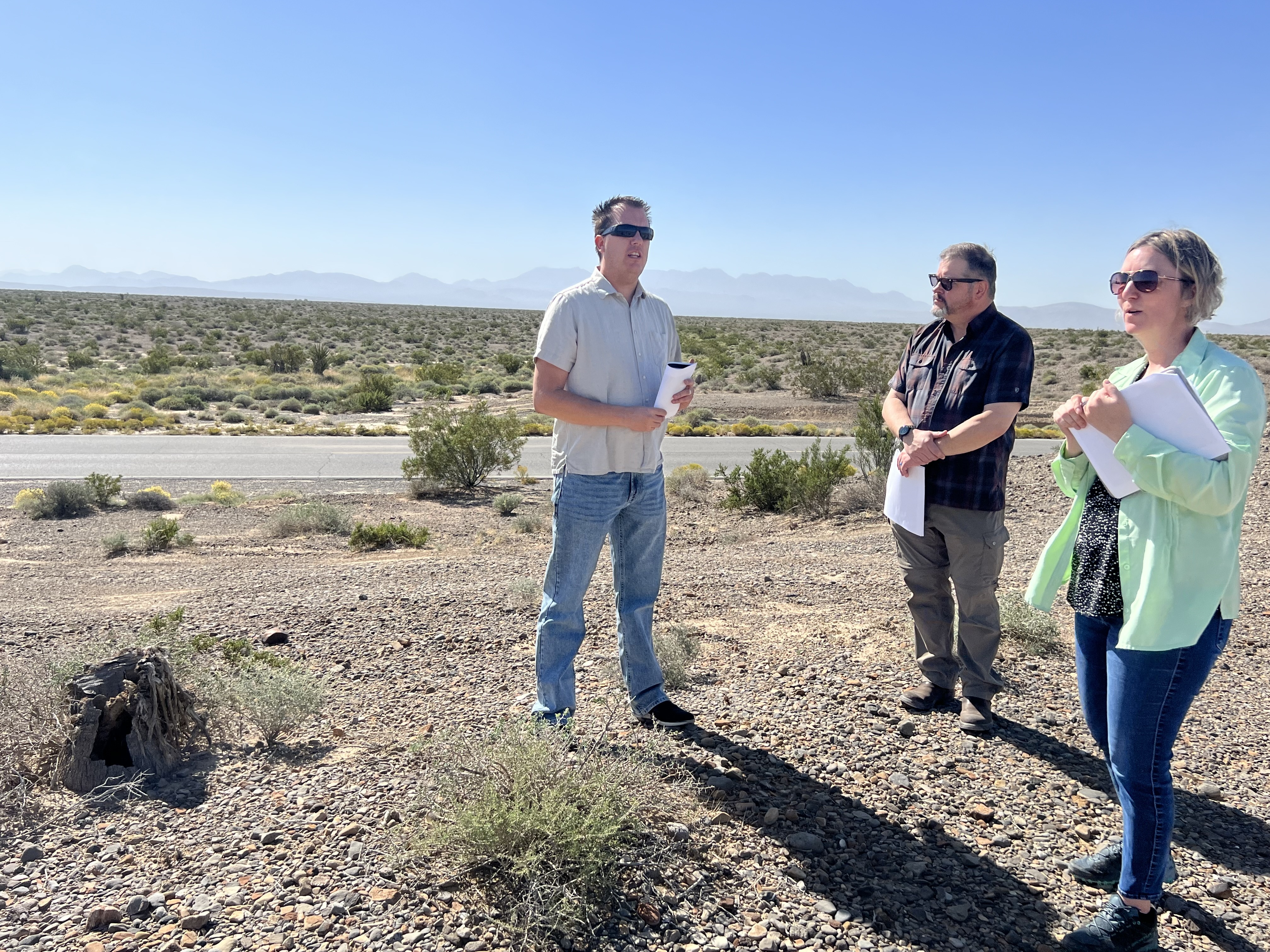 Nicholas Pay, manager of the Bureau of Land Management's Pahrump Field office, pictured left, and Beth Ransel, a BLM supervisory project manager, far right, at the site of the Golden Currant Solar Project. Nicholas Pay, manager of the Bureau of Land Management's Pahrump Field office, pictured left, and Beth Ransel, a BLM supervisory project manager, far right, at the site of the Golden Currant Solar Project.