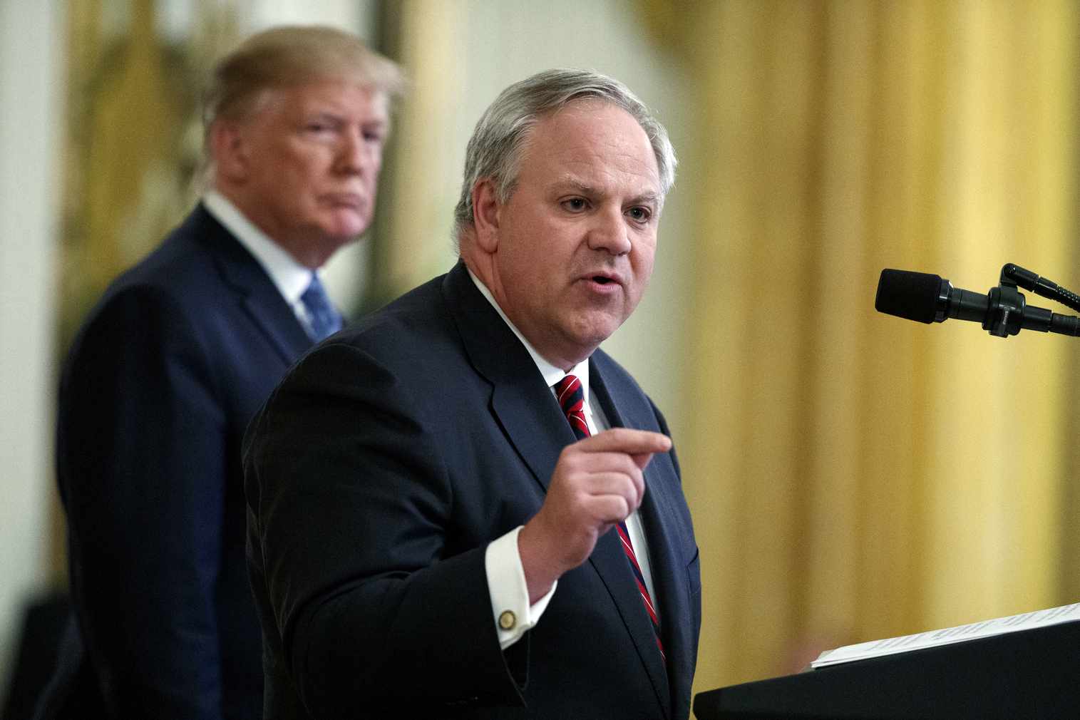 FILE - In this July 8, 2019 file photo President Donald Trump listens as Secretary of the Interior David Bernhardt speaks during an event on the environment in the East Room of the White House in Washington. Seven environmental and animal protection groups teamed up to file the first lawsuit challenging the Trump administration's rollback of the Endangered Species Act. The environmental law nonprofit Earthjustice filed the lawsuit Wednesday, Aug. 21, 2019, on behalf of the Center for Biological Diversity, Defenders of Wildlife, Sierra Club, Natural Resources Defense Council, National Parks Conservation Association, WildEarth Guardians, and the Humane Society of the United States. The lawsuit comes after the federal government earlier this month announced a series of changes to weaken the Endangered Species Act. (AP Photo/Evan Vucci, File) FILE - In this July 8, 2019 file photo President Donald Trump listens as Secretary of the Interior David Bernhardt speaks during an event on the environment in the East Room of the White House in Washington. Seven environmental and animal protection groups teamed up to file the first lawsuit challenging the Trump administration's rollback of the Endangered Species Act. The environmental law nonprofit Earthjustice filed the lawsuit Wednesday, Aug. 21, 2019, on behalf of the Center for Biological Diversity, Defenders of Wildlife, Sierra Club, Natural Resources Defense Council, National Parks Conservation Association, WildEarth Guardians, and the Humane Society of the United States. The lawsuit comes after the federal government earlier this month announced a series of changes to weaken the Endangered Species Act. (AP Photo/Evan Vucci, File)